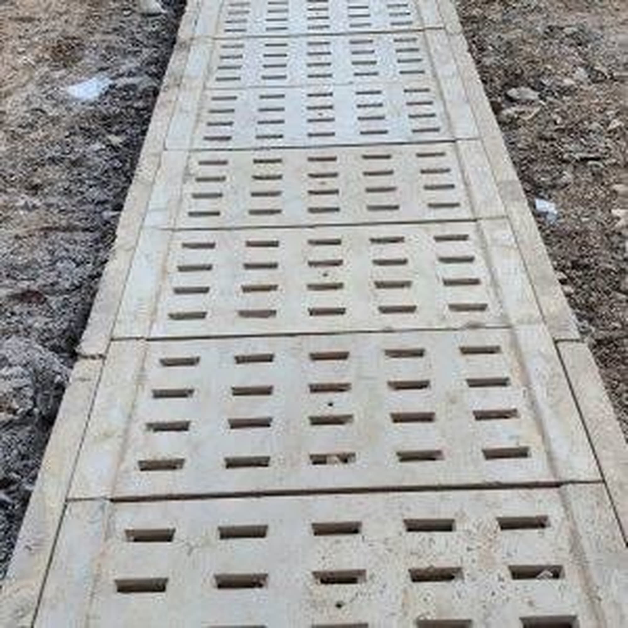 Factory-finished precast drain with cover
